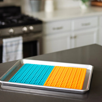 Messy Mutts mini bone treat maker trays in Orange and Blue